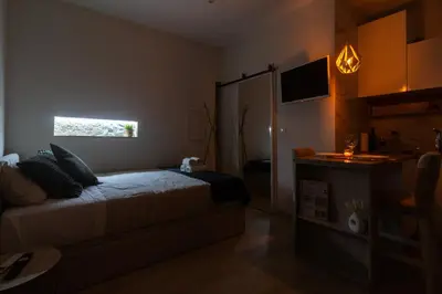 a small bedroom with a bed and a window at Lady Lapa by Lady Collection in Porto