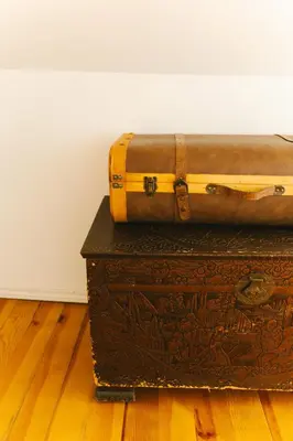 two old trunks sitting on top of a wooden floor at Studio Faria Guimarães in Porto