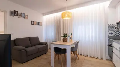 a living room with a table and a couch at Stop & Relax - Parking in Porto