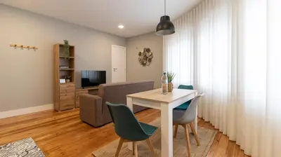 a dining room with a table and chairs at Stop & Relax - Parking in Porto