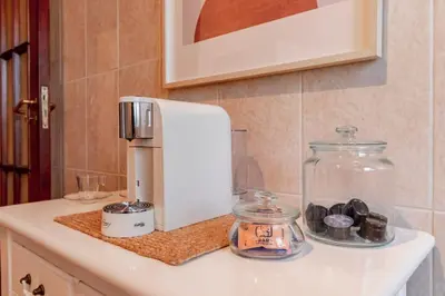 a coffee maker sitting on top of a counter at Apartamento com terraço in Porto