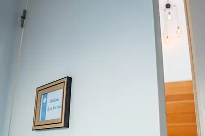 a picture frame hanging on a wall next to a door at Oporto Nura Studio Downtown in Porto
