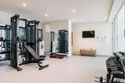 a gym with treadmills and machines in a room at Vila Catarina Luxury Apartments in Porto