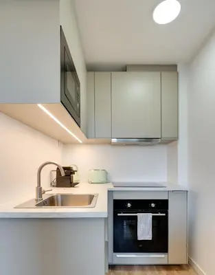 a kitchen with a sink and a dishwasher at Rola Art Work Studio II by DA'HOME in Porto