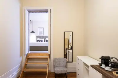 a room with a mirror and a room with a bed at Guesthouse Bonjardim by LovelyStay in Porto