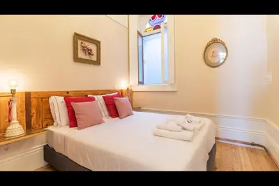 a bedroom with a bed with towels on it at AM Haven Studios - by Unique Hosts in Porto
