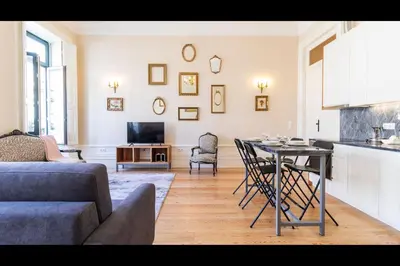 a kitchen and living room with a table and chairs at AM Haven Studios - by Unique Hosts in Porto