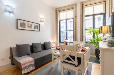 a living room with a couch and a table at Host Wise - Colourful Cozy Flat in Porto
