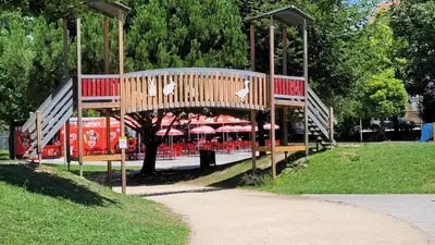 a park with a bunch of tables and umbrellas at Guest House CR5 in Porto