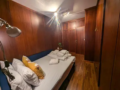 a room with a bed with towels on it at Travel and Live Poveiros in Porto