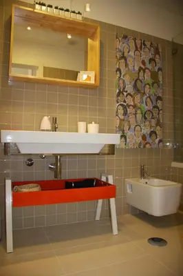 a bathroom with a sink and a tub and a mirror at Toctoc Yellow in Porto