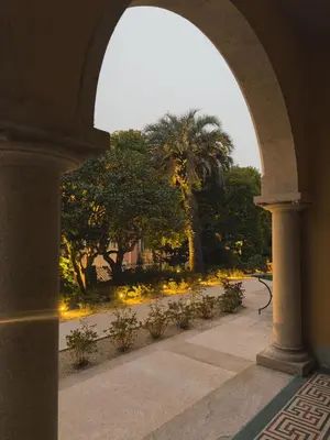 an archway with a view of a park with trees at Palacete Severo in Porto