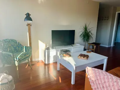 a living room with a tv and a coffee table at Premium Quental House - T3 Renovado com magnifico Terraço in Porto