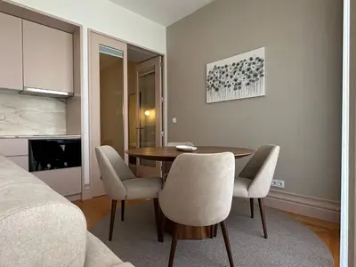 a room with a dining room table and chairs at Lit Apartments - CLÉRIGOS in Porto