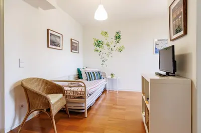 a laundry room with a washing machine in it at Studios Cedofeita in Porto