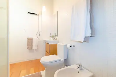 a kitchen with a sink and a microwave at Studios Cedofeita in Porto