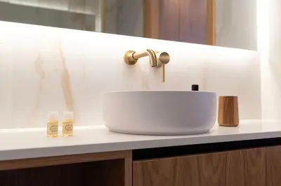 a bathroom sink with a faucet on a counter at Doispontozero Alegria Terracotta in Porto