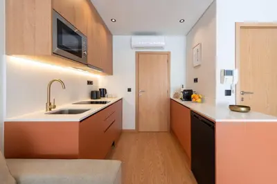 a kitchen with a sink and a counter top at Doispontozero Alegria Terracotta in Porto