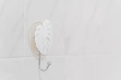 a white fan on a wall in a bathroom at GuestReady - Porto Saudade in Porto