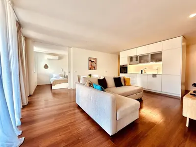 a living room with a couch and a table at Bombarda 250 E in Porto