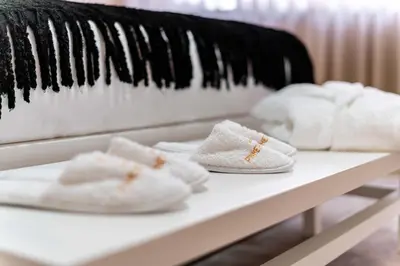 a pair of white shoes sitting on a shelf at Pinheiro Cardoso in Porto