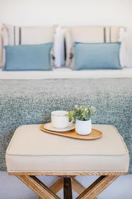 a bedroom with a large bed and a dining area at Cordoaria City Studio in Porto