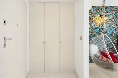 a room with a hanging basket and a painting at Boavista Loft in Porto