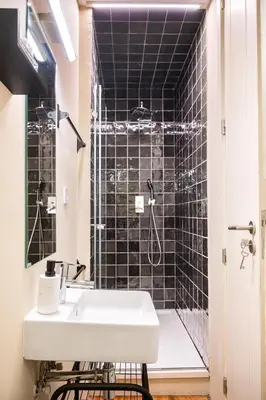 a bathroom with a sink and a shower at 42 2 F Historical apartment at Cardosas Block in Porto
