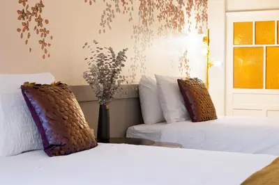 a bedroom with two beds and a window at 42 2 F Historical apartment at Cardosas Block in Porto