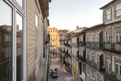 a view from a window of a street with buildings at 42 2 F Historical apartment at Cardosas Block in Porto