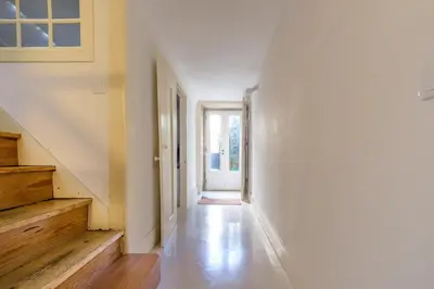 a bedroom with a bed with two towels on it at GuestReady - Historic Courtyard Townhouse in Porto