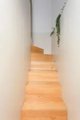 a staircase in a house with wooden floors at Liiiving in Porto - Bolhao Garden Apartment in Porto