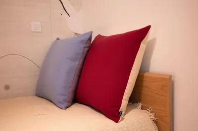 three pillows sitting on top of a bed at Take me to Aliados in Porto
