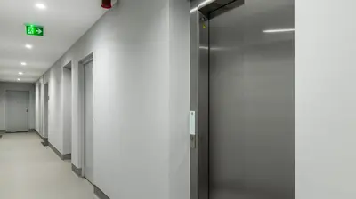 a corridor of elevators in an office building at Infante Studio w Parking by LovelyStay in Vila Nova de Gaia