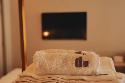a pile of towels sitting on a table in a room at Domum 4 in Porto