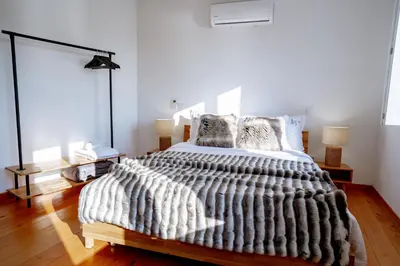 a bedroom with a large bed in a room at Authentic Porto Village in Porto