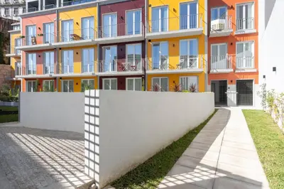 an apartment building with a fence in front of it at GuestReady - Tranquil haven in the city centre in Porto