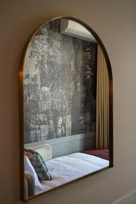 a mirror reflecting a bed in a room at 42 1T Cardosas Block Historic Ap in Porto