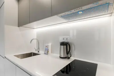 a kitchen with a sink and a coffee maker on a counter at GuestReady - Trendy getaway in the heart of Porto in Porto