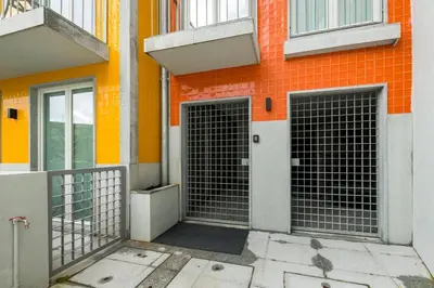 two gates on the side of a building at GuestReady - Trendy getaway in the heart of Porto in Porto
