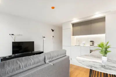 a living room with a couch and a table at GuestReady - Trendy getaway in the heart of Porto in Porto