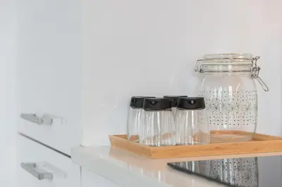 a glass jar on a shelf in a kitchen at GuestReady - Riverview Douro Balcony in Vila Nova de Gaia