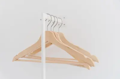 a bunch of wooden hangers hanging from a wall at GuestReady - Riverview Douro Balcony in Vila Nova de Gaia