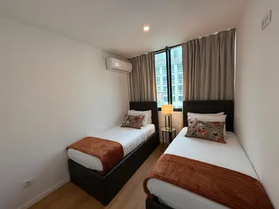 a hotel room with two beds and a window at ML Porto Plaza Avenue in Porto