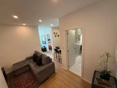 a living room with a couch and a table at ML Porto Plaza Avenue in Porto