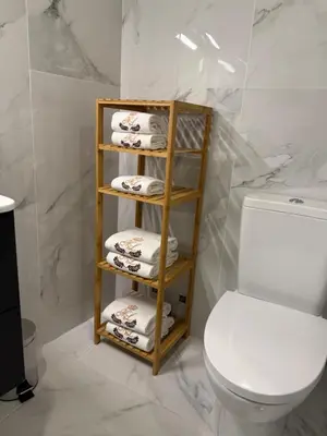 a bathroom with a towel rack next to a toilet at ML Porto Plaza Avenue in Porto