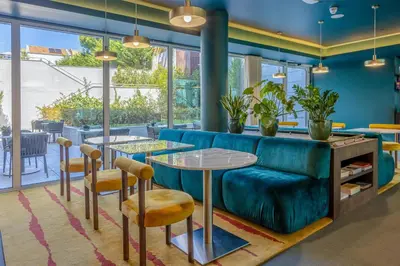 an overhead view of a building with tables and chairs at Cenica Porto Hotel, Curio Collection By Hilton in Porto