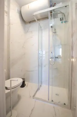 a bathroom with a shower and a toilet at Oporto Charming Studio Gaia in Vila Nova de Gaia