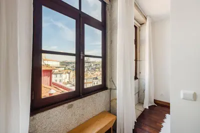 a room with a window with a view of a city at Hey Apartments B in Porto