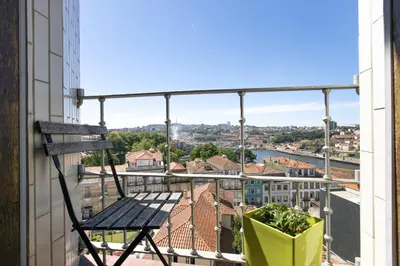 a balcony with a bench and a view of a city at LV Premier Apartments Clerigos- RE1 in Porto